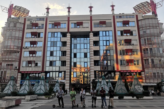E-Scooter Communist Yugoslavia Tour - The guide makes the architecture easier to read