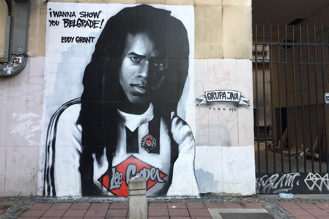 E-Scooter Street Art Tour - Savamala: graffiti beside old buildings